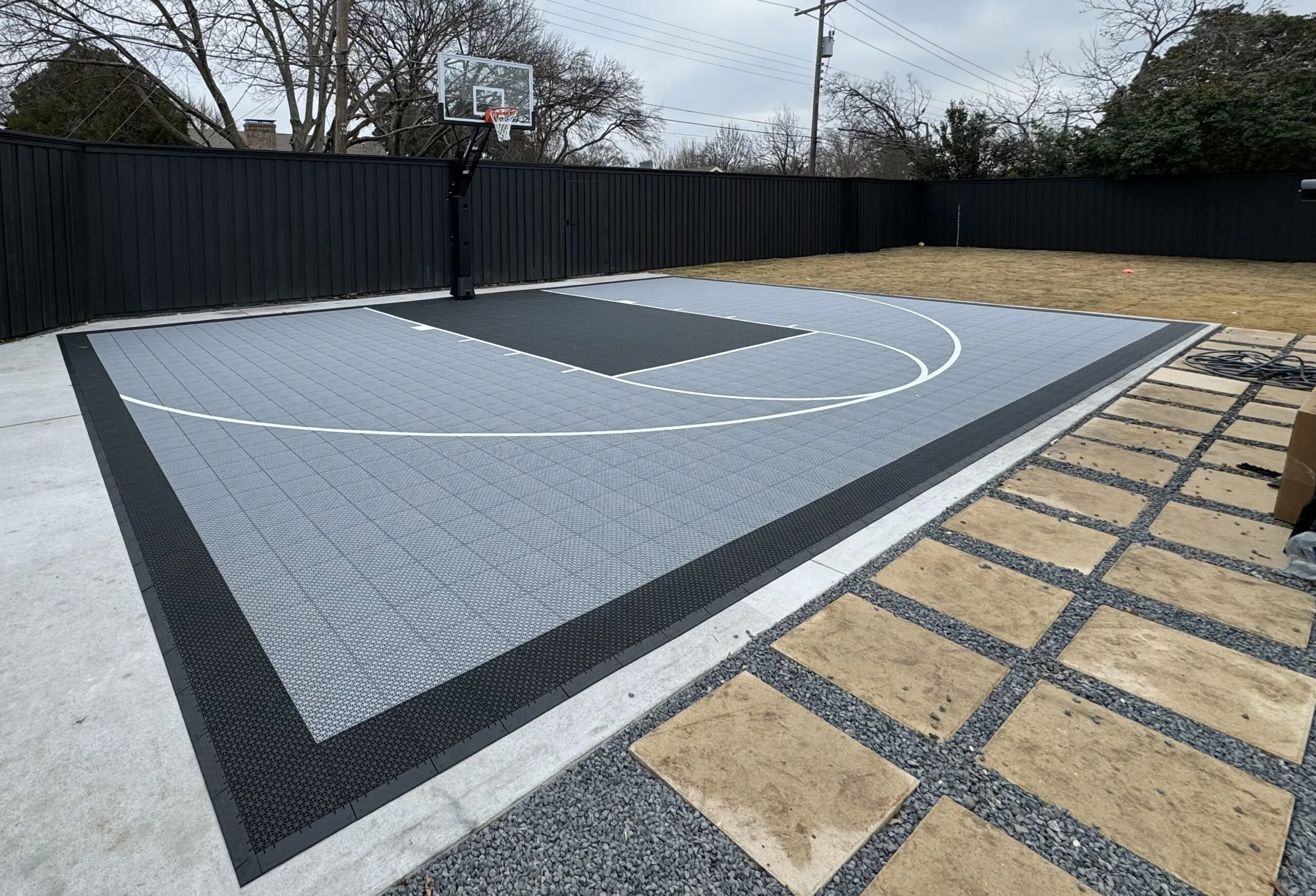 Custom basketball court installed by TGC Texas in a Dallas backyard
